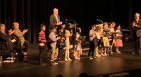 It was a packed house as student authors, the student who did the cover art, families, teachers, administrators, and trustees gathered at the Michael J Fox Theatre to celebrate […]